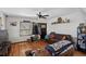 Inviting living room features wood floors, comfortable seating, and natural light from windows at 68251 E 96Th Ave, Byers, CO 80103