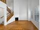 Living room with hardwood floors, fireplace, and large windows at 8457 E 35Th Ave, Denver, CO 80238