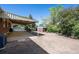 Well-maintained backyard featuring a covered patio and a storage shed, perfect for outdoor activities and storage at 392 Central Ave, Brighton, CO 80601