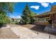 Large backyard space offering outdoor activities with a patio cover attached to the side of the house at 392 Central Ave, Brighton, CO 80601