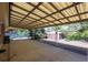 A spacious covered patio in a backyard offering potential for outdoor enjoyment and entertaining at 392 Central Ave, Brighton, CO 80601