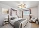 Comfortable bedroom featuring a large bed, a sitting area, and windows that provide ample natural light at 392 Central Ave, Brighton, CO 80601