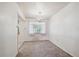 Bright dining room with a chandelier and neutral carpet at 392 Central Ave, Brighton, CO 80601