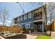Exterior of house with patio furniture, dining set and lush, manicured backyard with patio at 2978 Osceola St, Denver, CO 80212