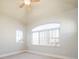 Bright bedroom with large arched window, carpet, and neutral wall color at 2978 Osceola St, Denver, CO 80212