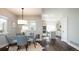 Dining area with modern chandelier, large windows, and easy access to the kitchen at 2978 Osceola St, Denver, CO 80212