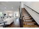 Open living room and staircase design with hardwood floors and modern decor at 2978 Osceola St, Denver, CO 80212