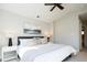 Tranquil main bedroom with a ceiling fan, and art pieces above the bed and a vaulted ceiling at 2978 Osceola St, Denver, CO 80212