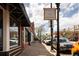 Lively neighborhood street with shops, restaurants, and pedestrian-friendly sidewalks at 2978 Osceola St, Denver, CO 80212