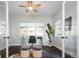 Bright office space with glass desk, ceiling fan, and ample natural light at 2978 Osceola St, Denver, CO 80212