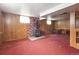 Basement with brick fireplace and wood burning stove at 5935 Blanca Ct, Golden, CO 80403