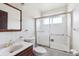 Standard white bathroom with shower/tub combo and neutral colored countertop at 5935 Blanca Ct, Golden, CO 80403