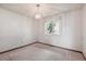 Vacant bedroom with neutral carpet and a window at 5935 Blanca Ct, Golden, CO 80403