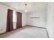 Bedroom features neutral carpeting and a window with drapes at 5935 Blanca Ct, Golden, CO 80403