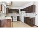 Functional kitchen featuring vintage appliances, ample counter space, and access to the sunroom at 5935 Blanca Ct, Golden, CO 80403
