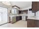 Functional kitchen featuring vintage appliances, ample counter space, and access to the sunroom at 5935 Blanca Ct, Golden, CO 80403