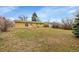 Expansive backyard space with lush grass and mature trees, providing ample outdoor enjoyment at 2971 S Sheridan Blvd, Denver, CO 80227