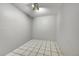 Unfinished basement with tile flooring, offering a blank canvas for customization and upgrades at 2971 S Sheridan Blvd, Denver, CO 80227