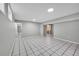 Spacious finished basement area with tiled floors and potential for multi-purpose usage at 2971 S Sheridan Blvd, Denver, CO 80227