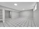 Finished basement area with tiled flooring, creating a versatile space for recreation or storage at 2971 S Sheridan Blvd, Denver, CO 80227