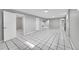 Open basement area with tiled flooring, ideal for versatile use and expansion at 2971 S Sheridan Blvd, Denver, CO 80227