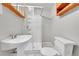 Bathroom featuring a stand up shower and sink with a wooden mirror cabinet above the toilet at 2971 S Sheridan Blvd, Denver, CO 80227