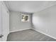 This bedroom has neutral walls, gray carpet and a double hung window providing natural light at 2971 S Sheridan Blvd, Denver, CO 80227