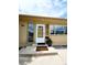 Inviting front entrance featuring a white door, decorative shutters, and a 'Welcome Home' mat at 2971 S Sheridan Blvd, Denver, CO 80227