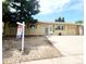 Charming single-story home with a well-maintained front yard and mature shade tree at 2971 S Sheridan Blvd, Denver, CO 80227