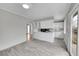 Well-lit kitchen with white cabinets and a view into the adjacent living space at 2971 S Sheridan Blvd, Denver, CO 80227