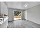 Kitchen area with sliding glass door at 2971 S Sheridan Blvd, Denver, CO 80227