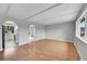 Spacious living room with wood floors, arched doorways, and natural light at 2971 S Sheridan Blvd, Denver, CO 80227