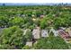 Aerial view of a neighborhood with lush trees, showcasing houses with rooftop detail at 836 Steele St, Denver, CO 80206