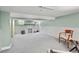 Spacious finished basement with painted fireplace, neutral carpet, and room for entertainment and relaxation at 836 Steele St, Denver, CO 80206