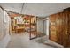 Unfinished basement storage space with wood shelving and access to utilities, providing ample room for organization at 836 Steele St, Denver, CO 80206