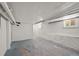 Unfinished basement with painted walls and window, offering potential for customization and storage at 836 Steele St, Denver, CO 80206