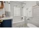 Elegant bathroom featuring a shower and tub, classic tiling, and modern fixtures at 836 Steele St, Denver, CO 80206