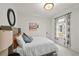 Comfortable bedroom bathed in natural light, featuring neutral tones, and ample space for relaxation at 836 Steele St, Denver, CO 80206
