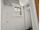 Unique closet space with hooks, wallpapered ceiling, and built-in shelving at 836 Steele St, Denver, CO 80206