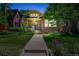 Charming brick home featuring an inviting walkway, manicured lawn and lovely front garden at 836 Steele St, Denver, CO 80206
