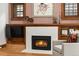 Cozy fireplace with stylish tile surround, and wood trim at 836 Steele St, Denver, CO 80206