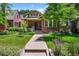 Charming front exterior of home with a well manicured lawn, walkway and landscaping at 836 Steele St, Denver, CO 80206