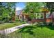 Beautiful brick home with a well-kept front lawn and charming curb appeal at 836 Steele St, Denver, CO 80206
