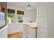 Bright hallway with custom wood work, white walls, hardwood floors and natural light at 836 Steele St, Denver, CO 80206