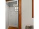 Hallway with coat hooks and overhead storage, offering a practical and organized entryway at 836 Steele St, Denver, CO 80206