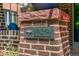Close up of brick post with house number 836 and a dragonfly at 836 Steele St, Denver, CO 80206