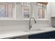 Well-lit kitchen featuring a modern faucet, undermount sink, and bright white countertop for a clean aesthetic at 836 Steele St, Denver, CO 80206