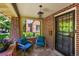 Inviting covered brick porch with seating offers a cozy outdoor space at 836 Steele St, Denver, CO 80206