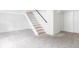 Spacious finished basement with stairs and grey carpet at 2655 S Humboldt St, Denver, CO 80210