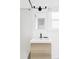 Updated bathroom with light wood vanity, new fixtures, white tile and a window at 2655 S Humboldt St, Denver, CO 80210
